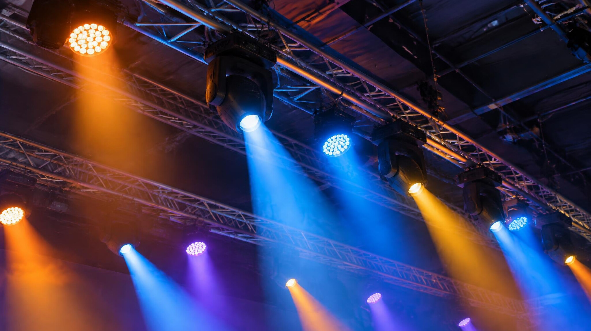 Stage lighting rig with coloured spotlights and truss